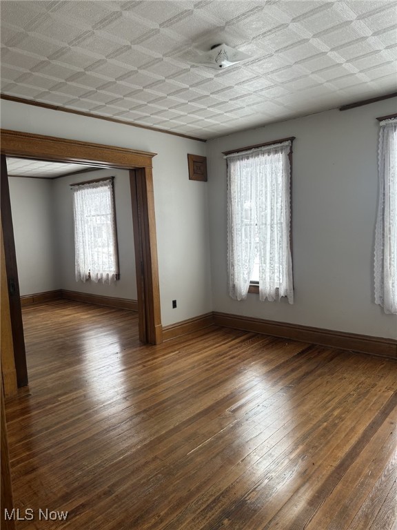 spare room featuring dark hardwood / wood-style flooring