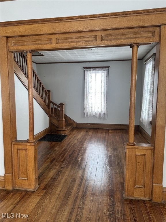 unfurnished living room featuring dark wood-type flooring