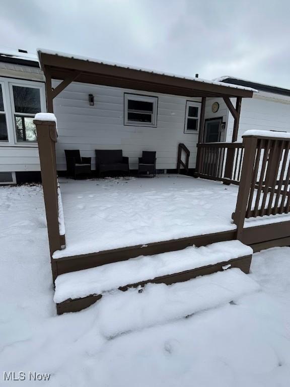 view of snow covered deck