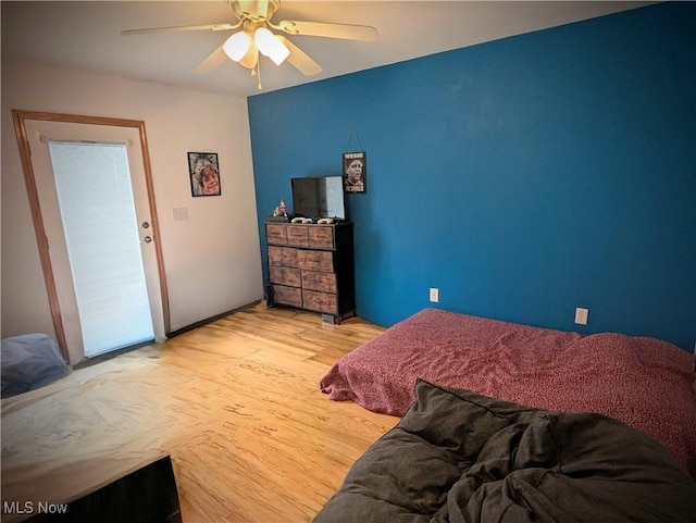 bedroom featuring light wood-type flooring and ceiling fan