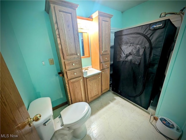 bathroom featuring vanity and toilet