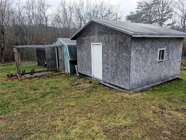 view of outdoor structure with a yard