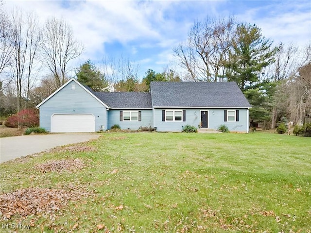 ranch-style house with a front yard and a garage