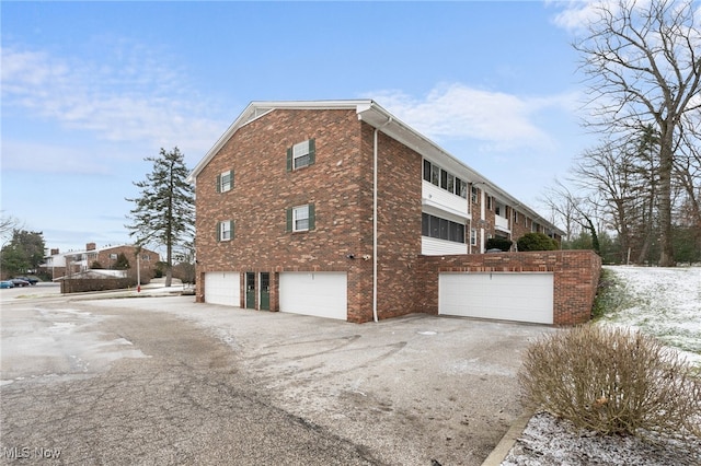 view of property exterior with a garage