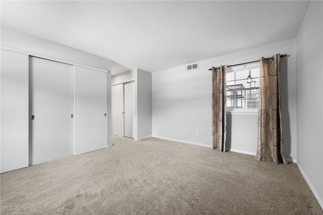 unfurnished bedroom with light carpet