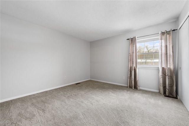 empty room featuring carpet floors