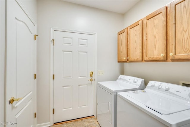 washroom with cabinets and independent washer and dryer