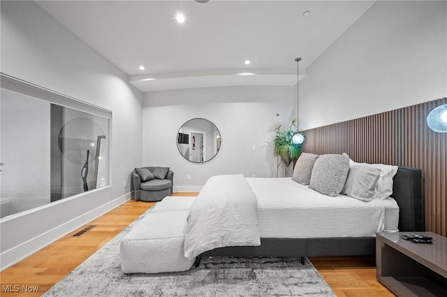 bedroom with hardwood / wood-style flooring