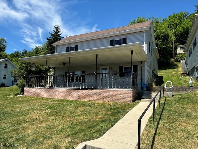 view of front of property featuring a front yard and a porch