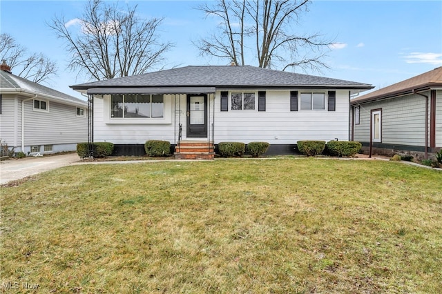 ranch-style home with a front lawn