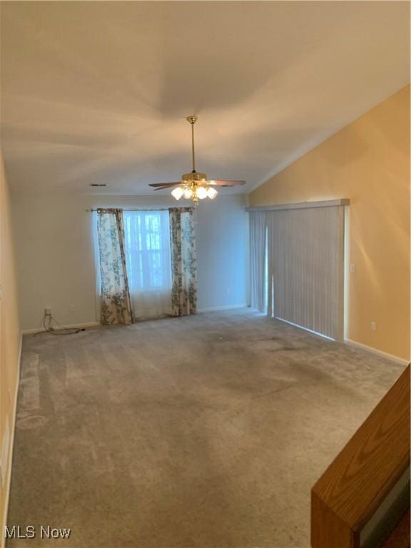 unfurnished room with carpet and ceiling fan