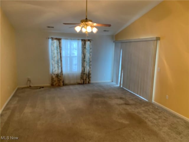 spare room with carpet and ceiling fan