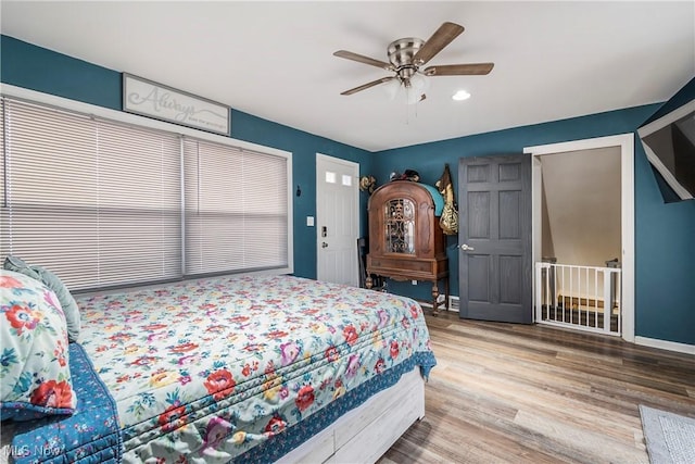 bedroom with hardwood / wood-style flooring and ceiling fan