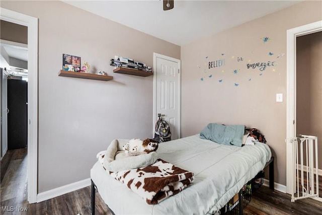 bedroom featuring dark hardwood / wood-style flooring