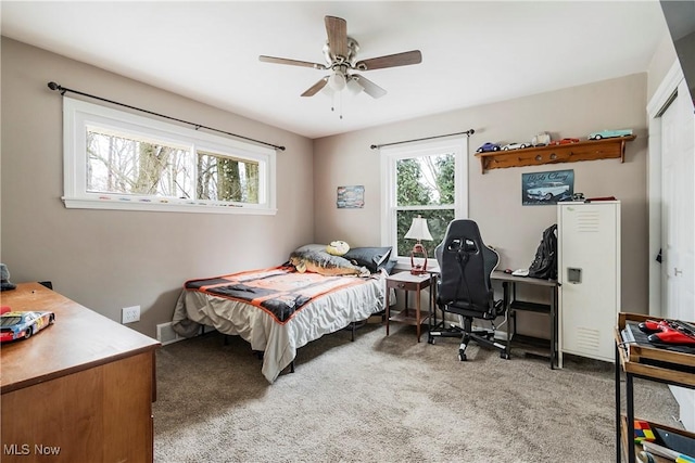 carpeted bedroom with ceiling fan