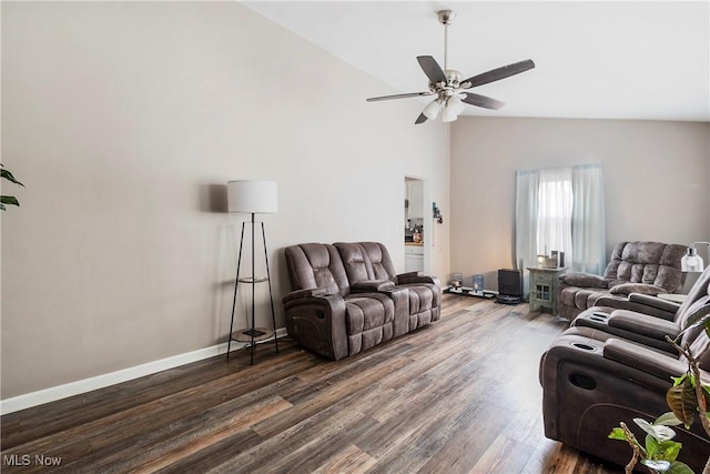 living room with dark hardwood / wood-style floors, ceiling fan, and lofted ceiling