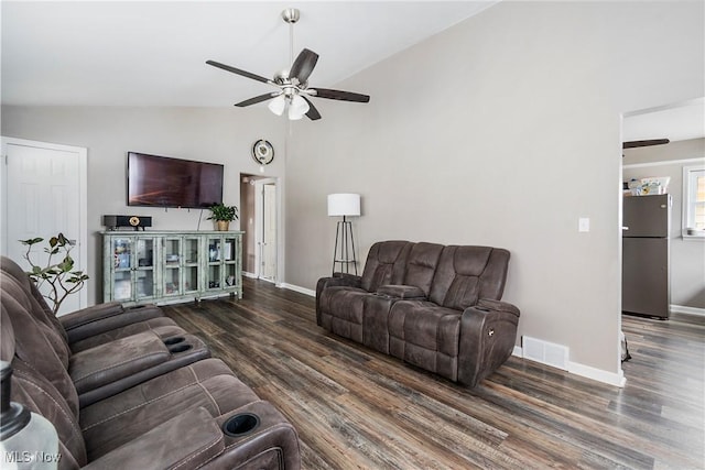 living room with dark wood-type flooring, ceiling fan, and lofted ceiling