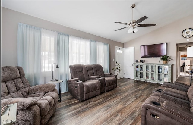 living room featuring ceiling fan, dark hardwood / wood-style flooring, and vaulted ceiling