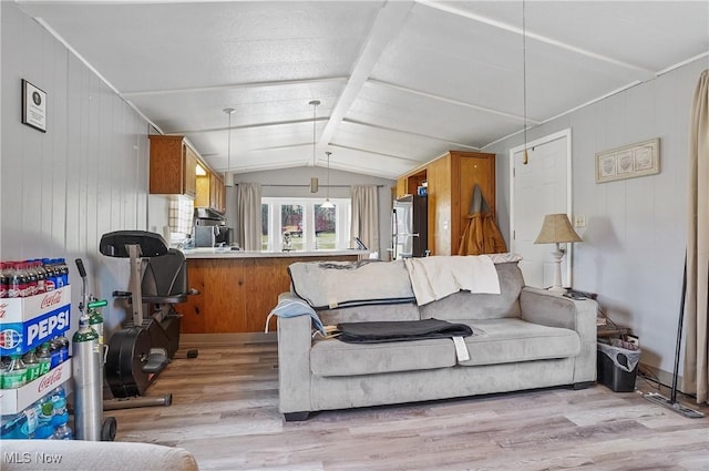 living room with vaulted ceiling and light hardwood / wood-style floors