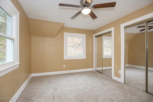 bonus room featuring a wealth of natural light, ceiling fan, and lofted ceiling