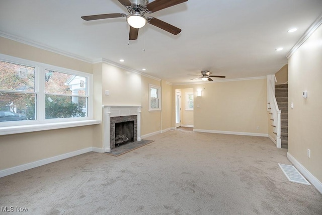 unfurnished living room with ceiling fan, light colored carpet, and ornamental molding