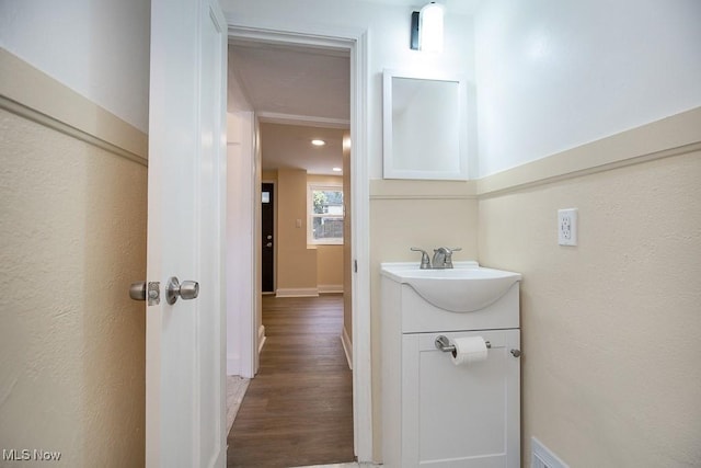 bathroom featuring vanity and hardwood / wood-style flooring