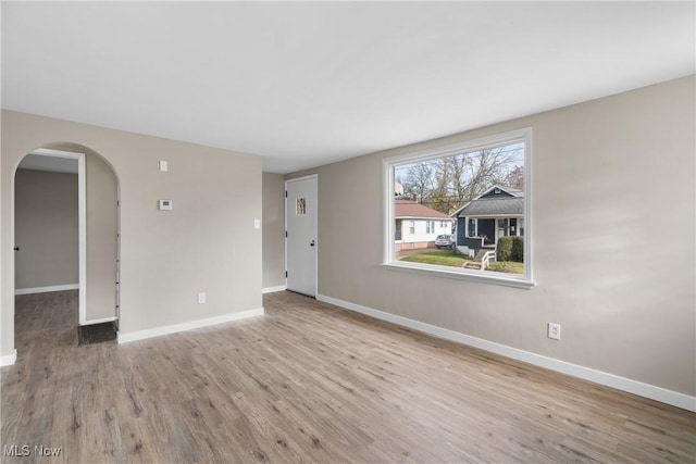 spare room with light hardwood / wood-style floors