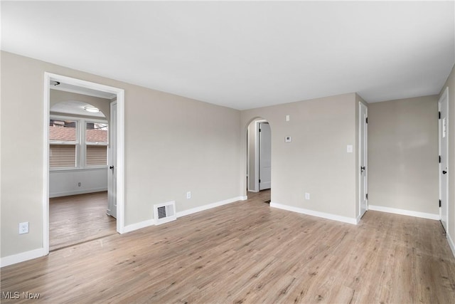 empty room with light hardwood / wood-style floors