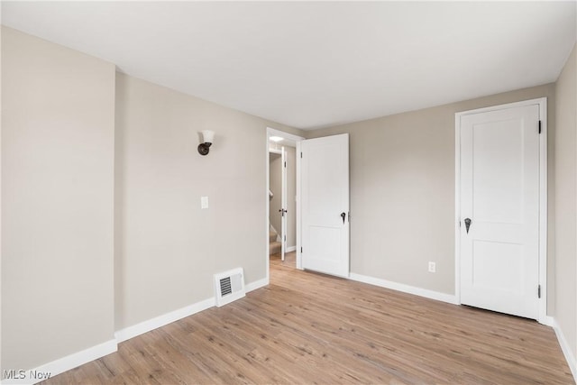 empty room featuring light hardwood / wood-style floors