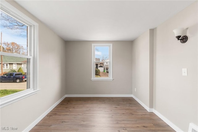 unfurnished room featuring light wood-type flooring