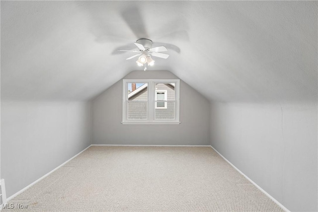 bonus room featuring carpet floors, ceiling fan, and lofted ceiling