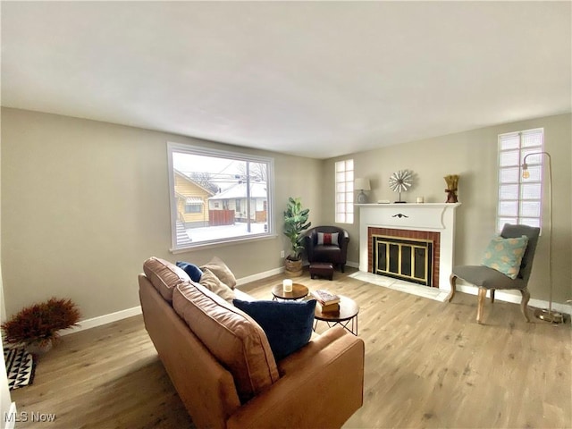 living room with wood-type flooring and a fireplace