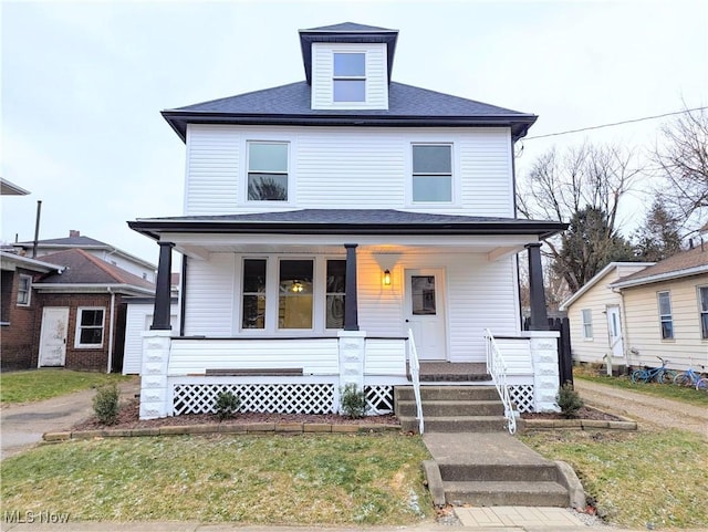 view of front facade featuring a porch and a front yard