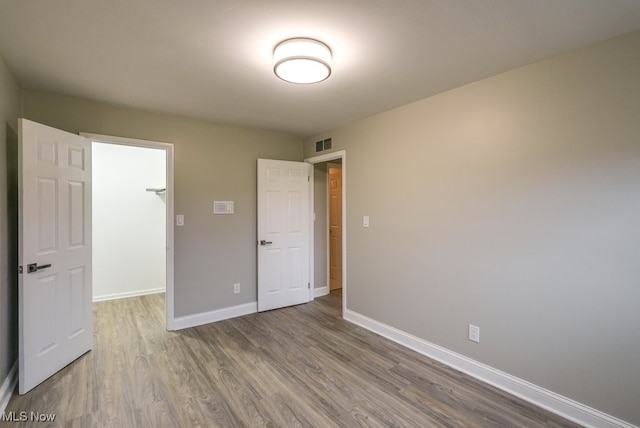 unfurnished bedroom featuring hardwood / wood-style floors