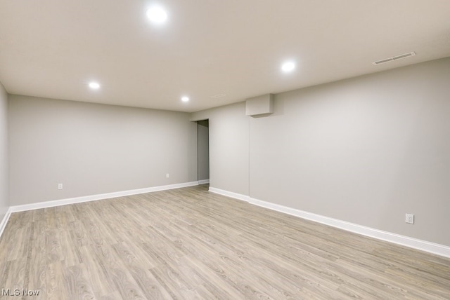 basement featuring light hardwood / wood-style floors