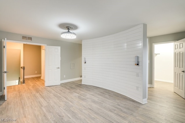 unfurnished room with light hardwood / wood-style flooring