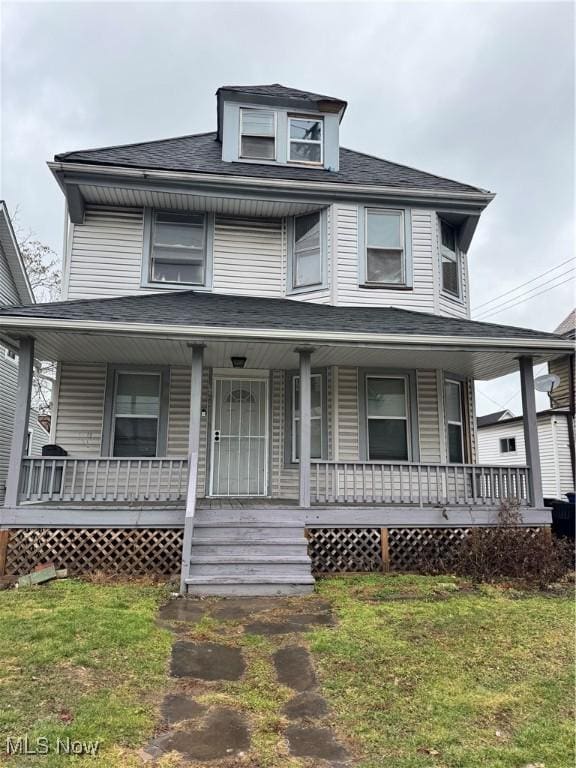 view of front of home featuring a front lawn and a porch