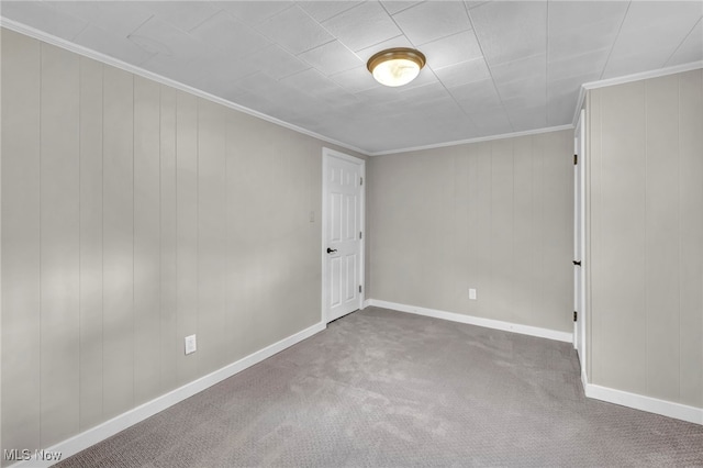 carpeted empty room featuring ornamental molding