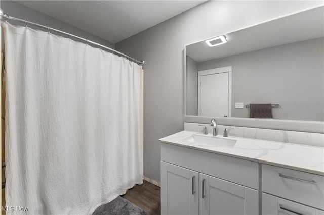 bathroom with wood-type flooring and vanity