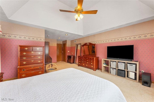 carpeted bedroom with ceiling fan and lofted ceiling