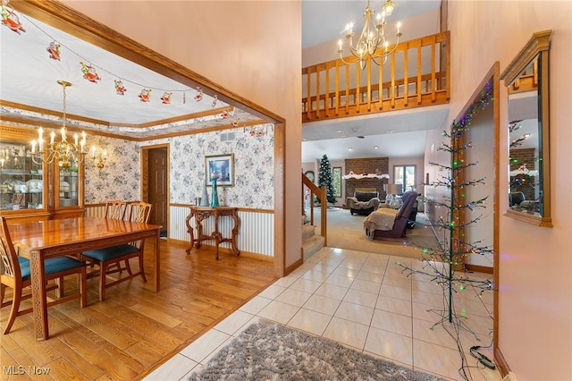 interior space featuring a notable chandelier and a fireplace