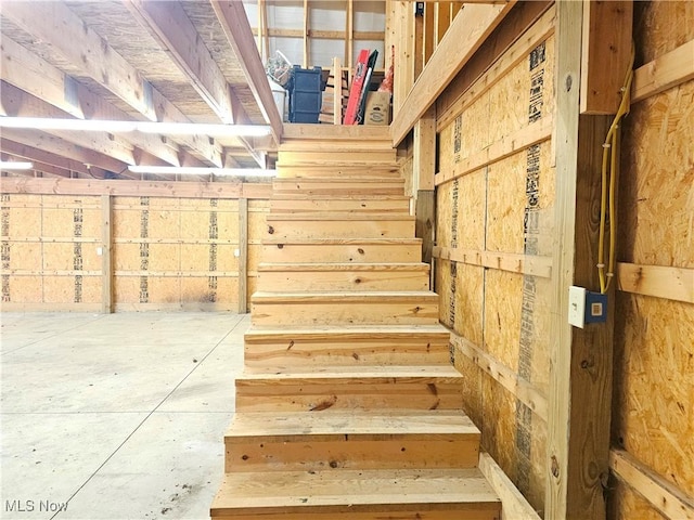 stairway with concrete floors