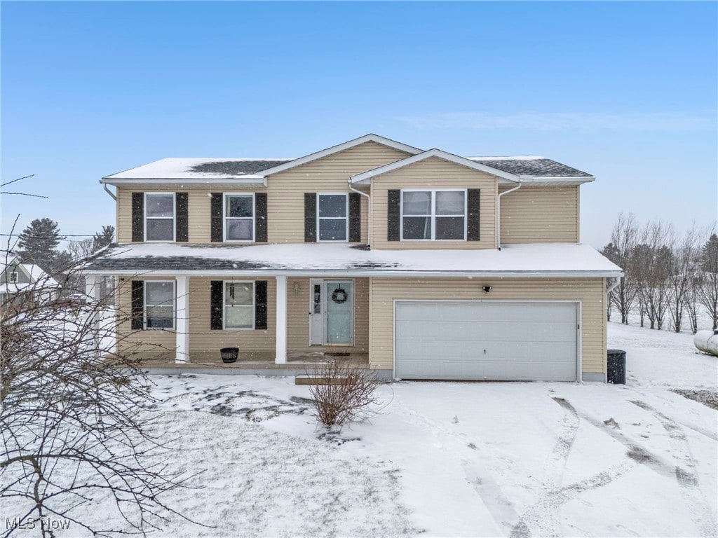 front of property featuring a garage