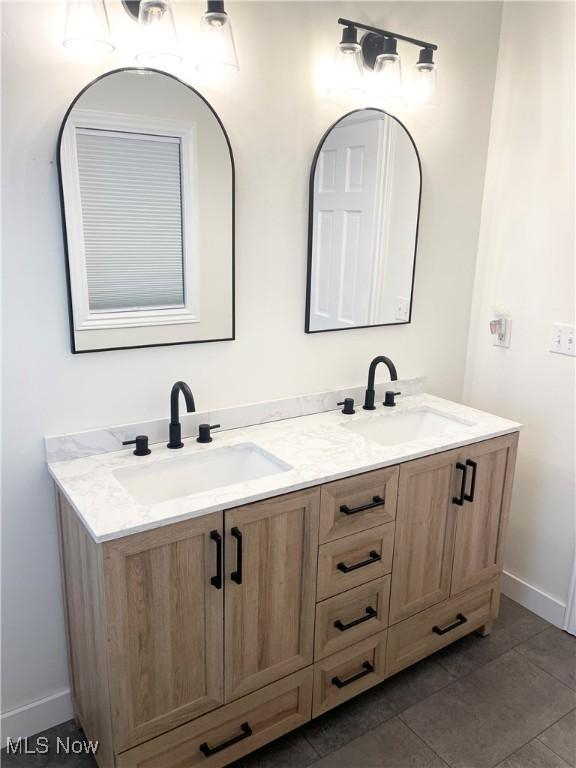 bathroom featuring tile patterned floors and vanity