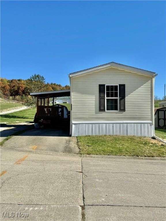 view of property exterior with a carport