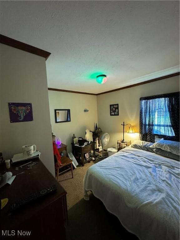 carpeted bedroom featuring crown molding