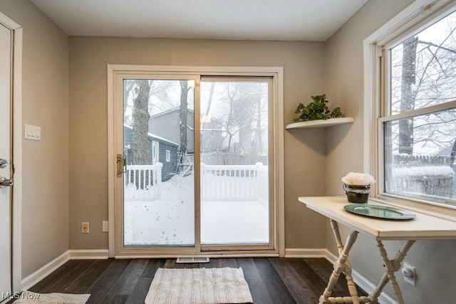 entryway with dark hardwood / wood-style floors