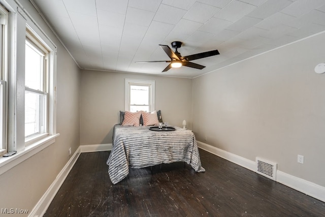 bedroom featuring ceiling fan and hardwood / wood-style flooring