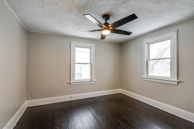 unfurnished room featuring wood-type flooring, ceiling fan, and a healthy amount of sunlight