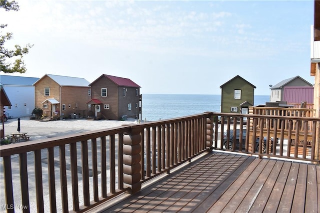wooden deck with a water view